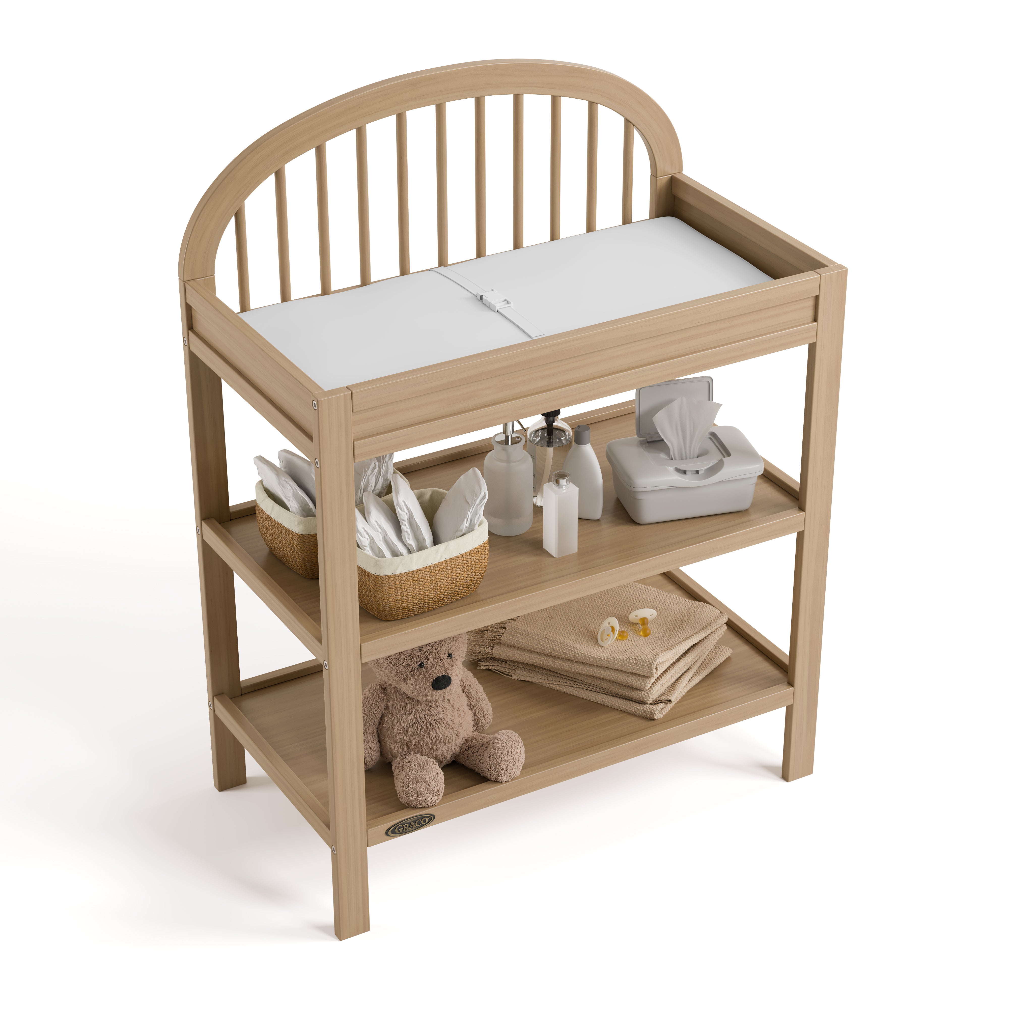 Olivia driftwood changing table top view with baby items on shelves