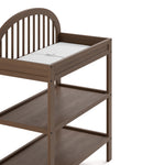 Olivia hazelnut changing table angled side view