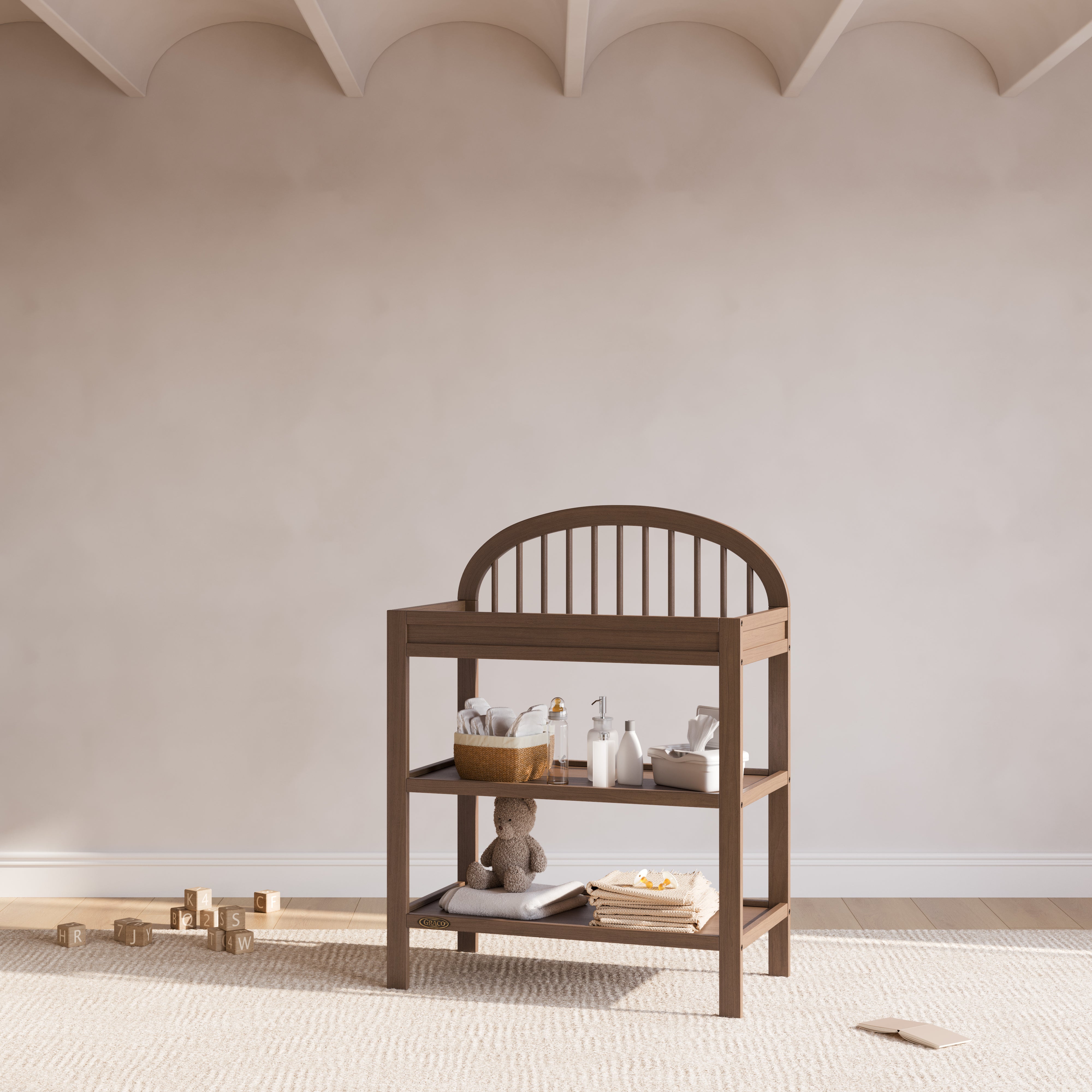 Olivia hazelnut changing table in a nursery