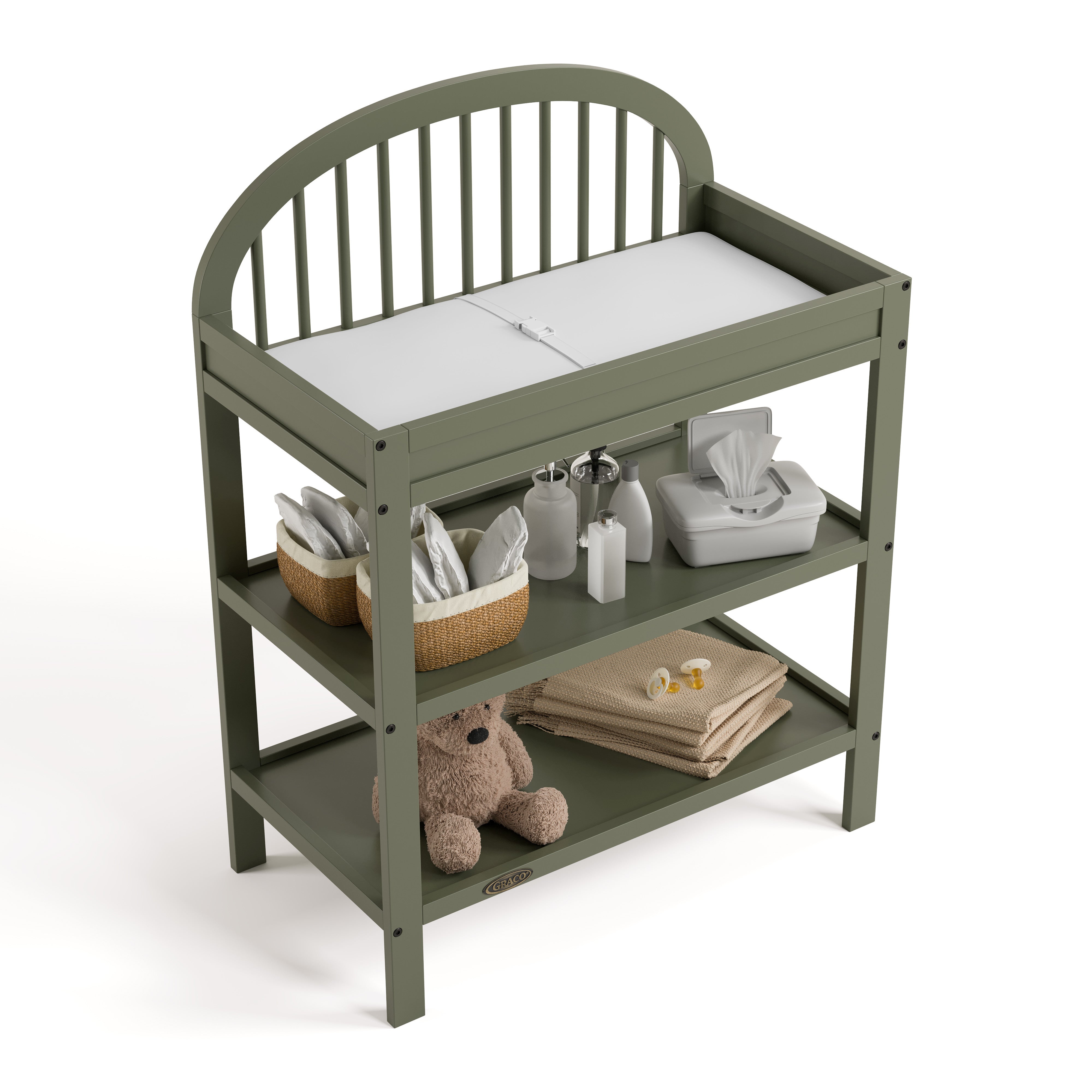 Olivia olive changing table top view with baby items on shelves