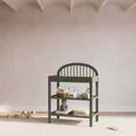Olivia olive changing table in a nursery