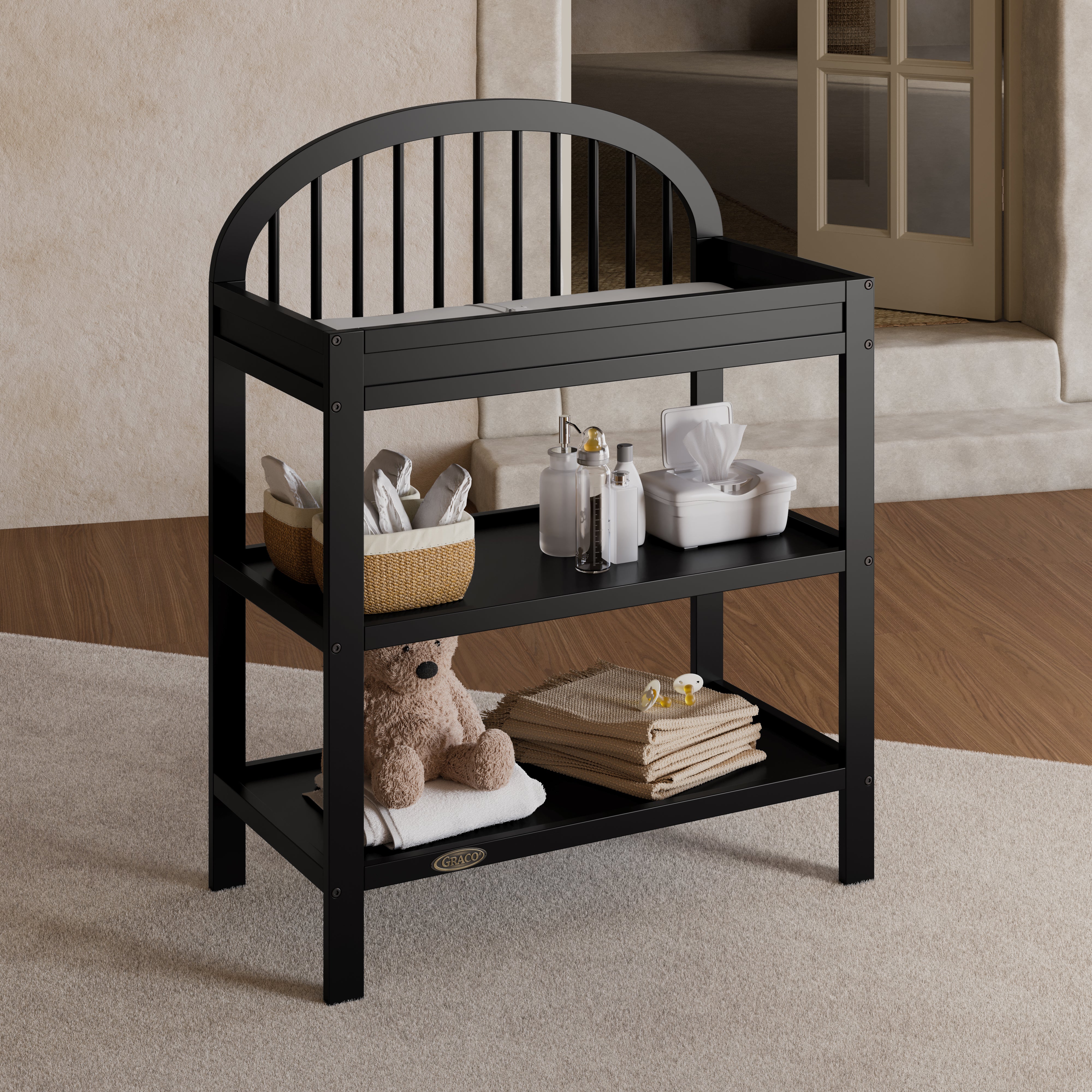 Olivia black changing table in a nursery