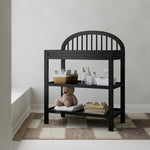 Olivia black changing table in a nursery