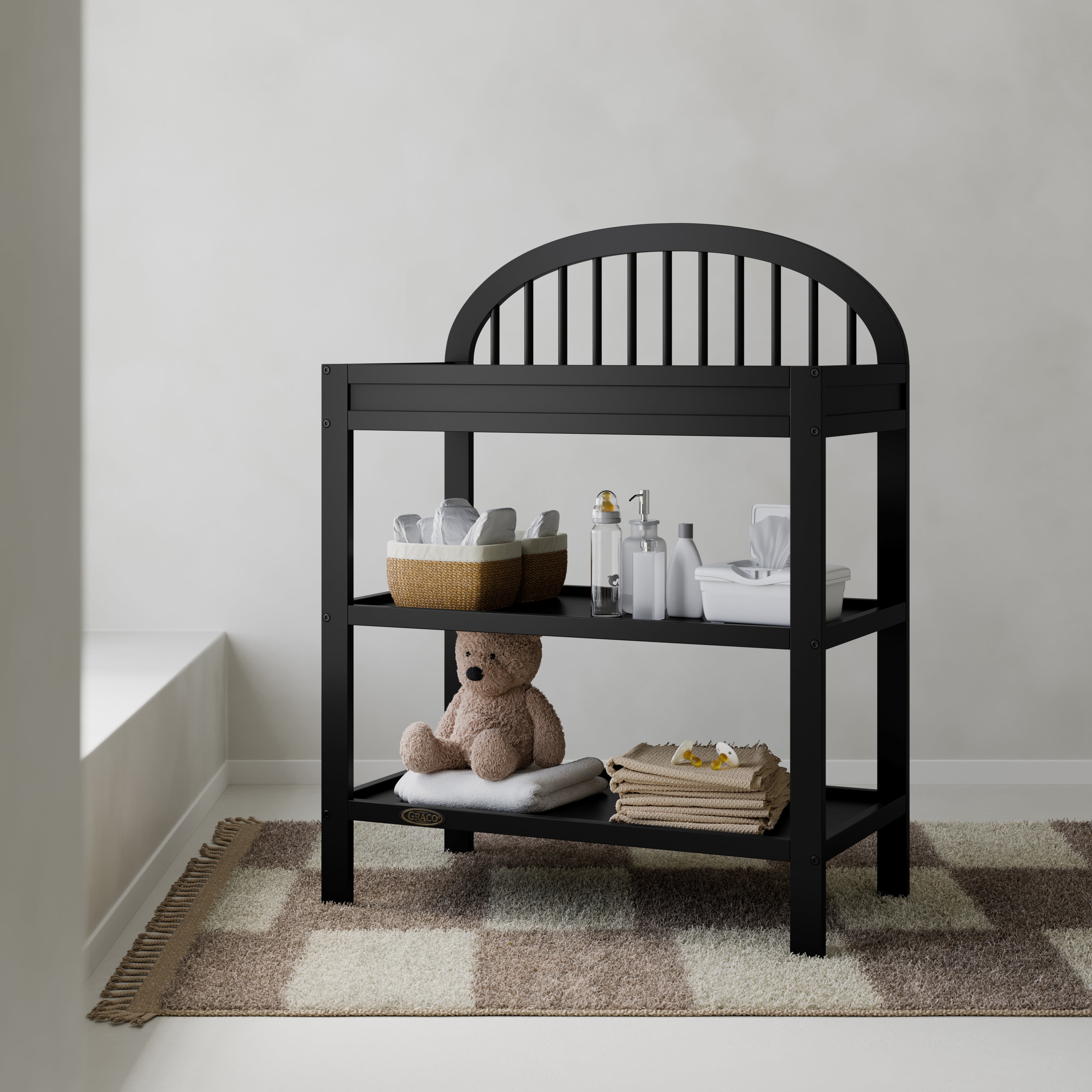 Olivia black changing table in a nursery
