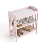 Benton blush changing table top view with baby items on both shelves