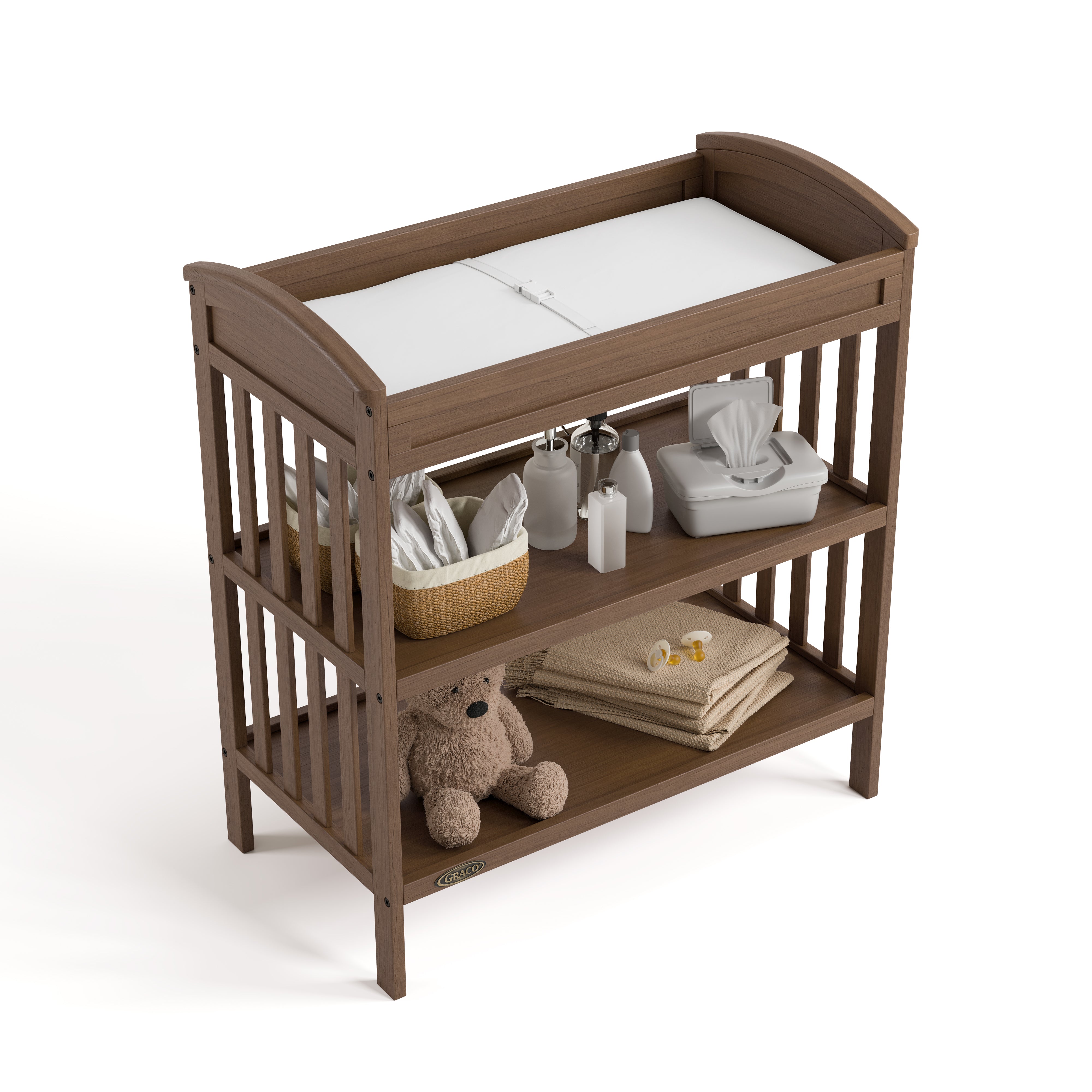 Benton hazelnut changing table top view with baby items on both shelves