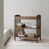 Benton hazelnut changing table in a nursery