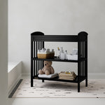 Benton black changing table in a nursery