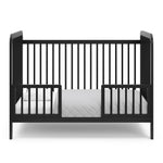 Black Toddler Safety Guardrail Kit with dowels applied in toddler bed