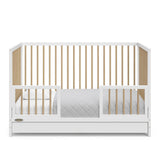 White with driftwood Toddler Safety Guardrail Kit with dowels applied in toddler bed