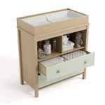 alpine 2 drawer changing chest driftwood with sage top view with changing pad and changing essentials in exterior shelves and top drawer