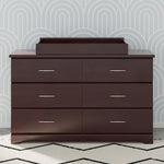 espresso changing topper on top of 6 drawer dresser in nursery