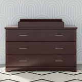 espresso changing topper on top of 6 drawer dresser in nursery