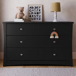 Crescent black 6 drawer dresser in a nursery