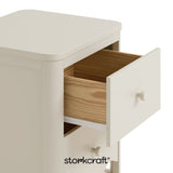 Casablanca frosted oat 2 drawer nightstand close up of top drawer open with black Storkcraft logo on bottom