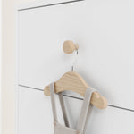 close up view of white dresser with driftwood knobs