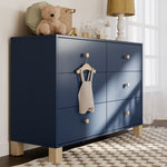 California midnight blue with driftwood 6 drawer dresser in a nursery