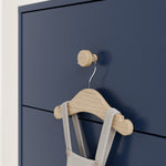 California midnight blue with driftwood 6 drawer dresser close up of drawer knob with baby hanger hanging on it