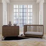 Santorini hazelnut 6 drawer dresser in a nursery next to crib