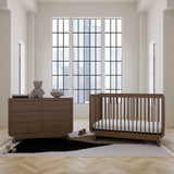 Santorini hazelnut 6 drawer dresser in a nursery next to crib