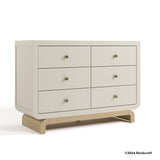 Santorini frosted oat with driftwood 6 drawer dresser with 2024 Storkcraft copyright on bottom right
