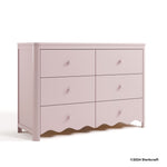 Casablanca blush 6 drawer dresser with 2024 Storkcraft copyright on bottom right