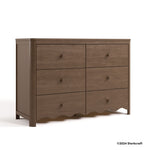 Casablanca hazelnut 6 drawer dresser with 2024 Storkcraft copyright on bottom right
