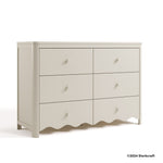 Casablanca frosted oat 6 drawer dresser with 2024 Storkcraft copyright on bottom right