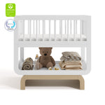 Santorini white with driftwood bassinet with GGG and PTPA logos on top left