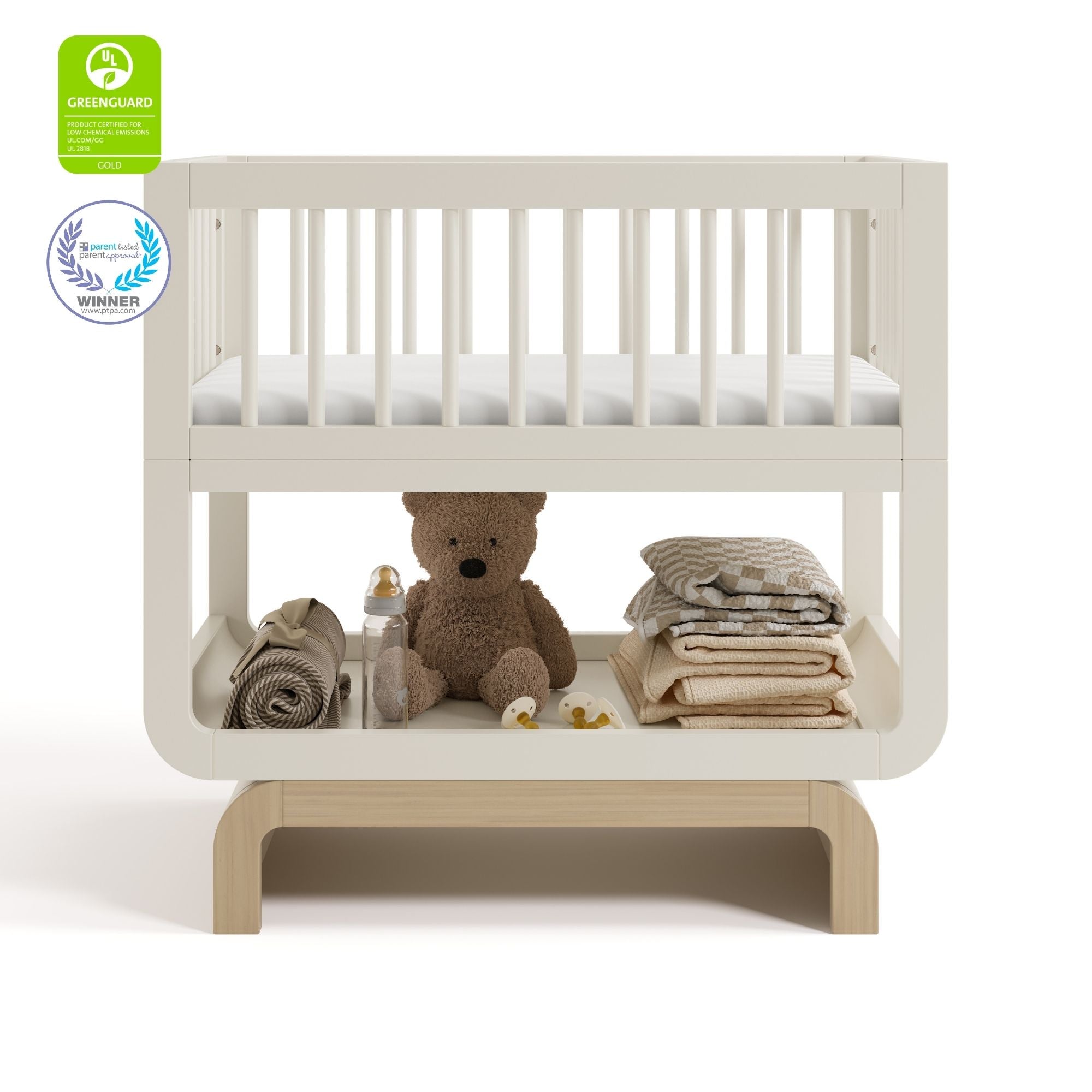 Santorini frosted oat with driftwood bassinet with GGG and PTPA logos on top left