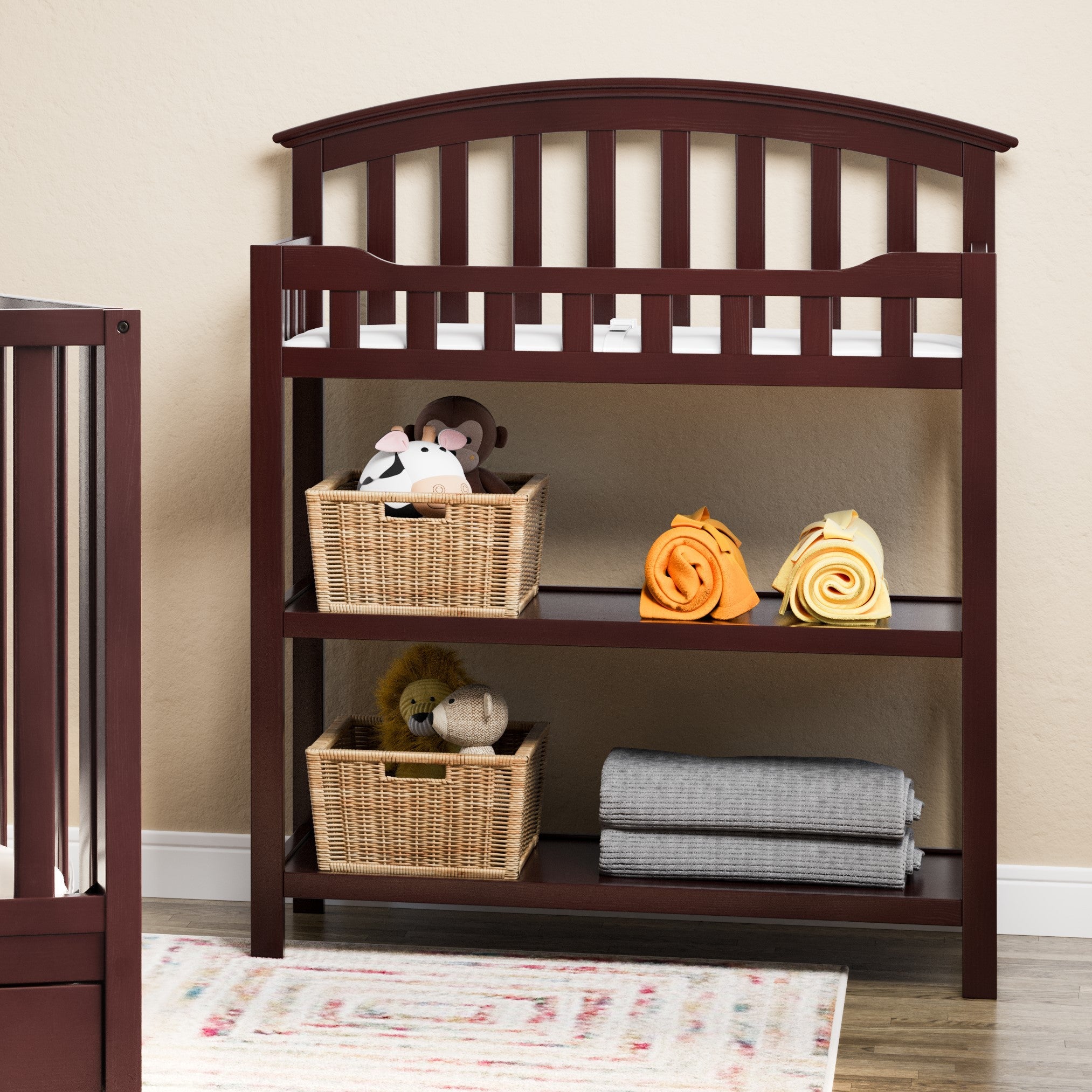 espresso changing table with two open shelves in nursery