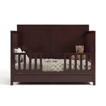 Hadley white crib with drawer converted to toddler bed with two guardrails