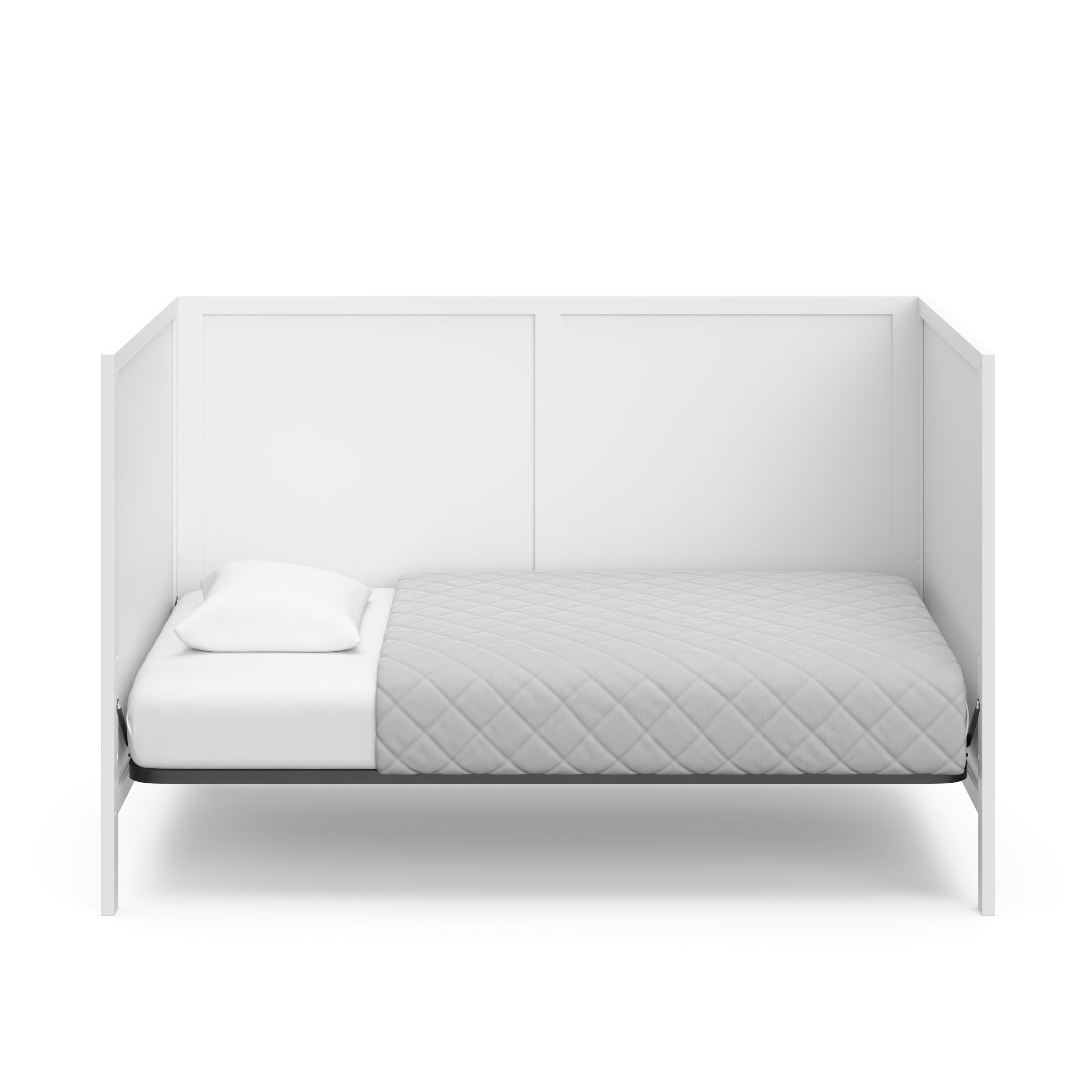 White crib in toddler bed conversion