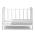 White crib in toddler bed conversion