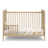 Driftwood crib in toddler bed conversion with one guardrail