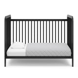 Black crib in toddler bed conversion
