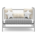 White with pebble gray crib in daybed conversion with bedding