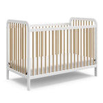 white crib with driftwood angled