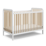 white crib with driftwood angled