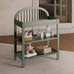 Olivia olive changing table in a nursery