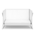 White crib in toddler bed conversion