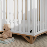 close-up view of white with vintage driftwood crib