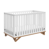 white crib with vintage driftwood angled