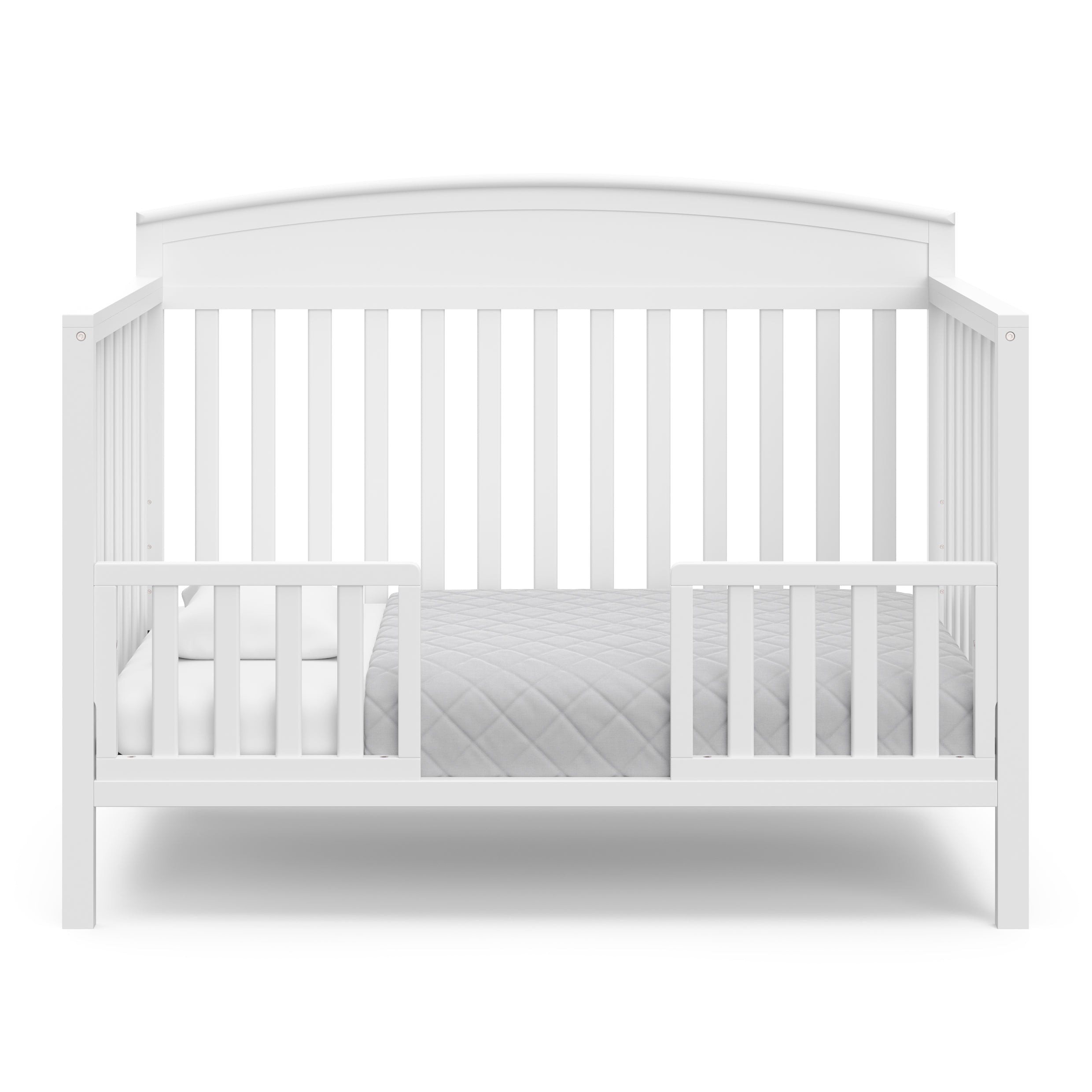 Benton white crib converted to toddler bed with two guardrails