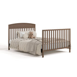 Benton hazelnut crib converted to full-size bed with footboard