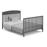gray crib in full-size bed with headboard and footbaord conversion