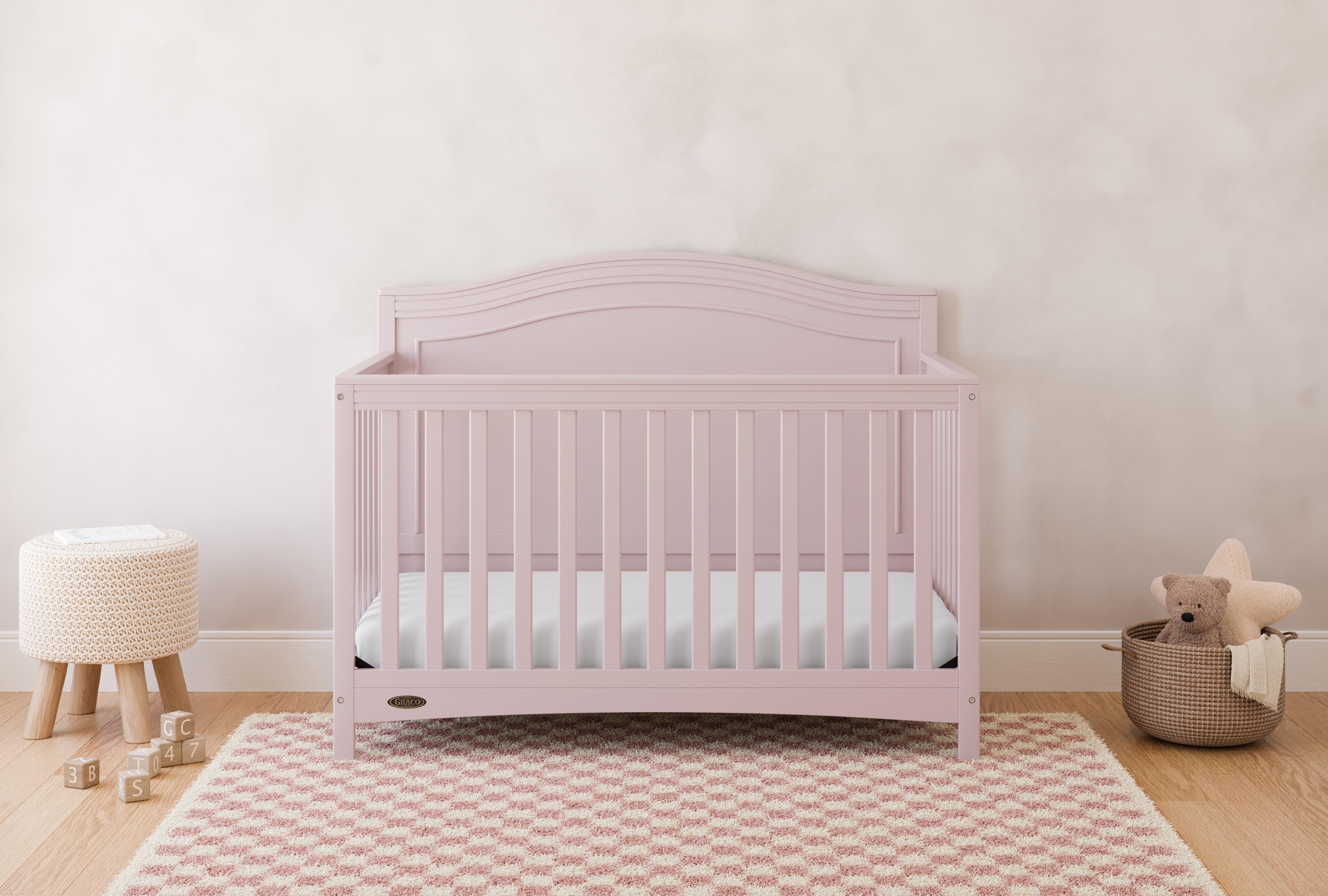 Paris blush crib in a nursery