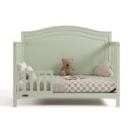 Paris sage crib converted to toddler bed with one guardrail
