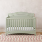 Paris sage crib in a nursery