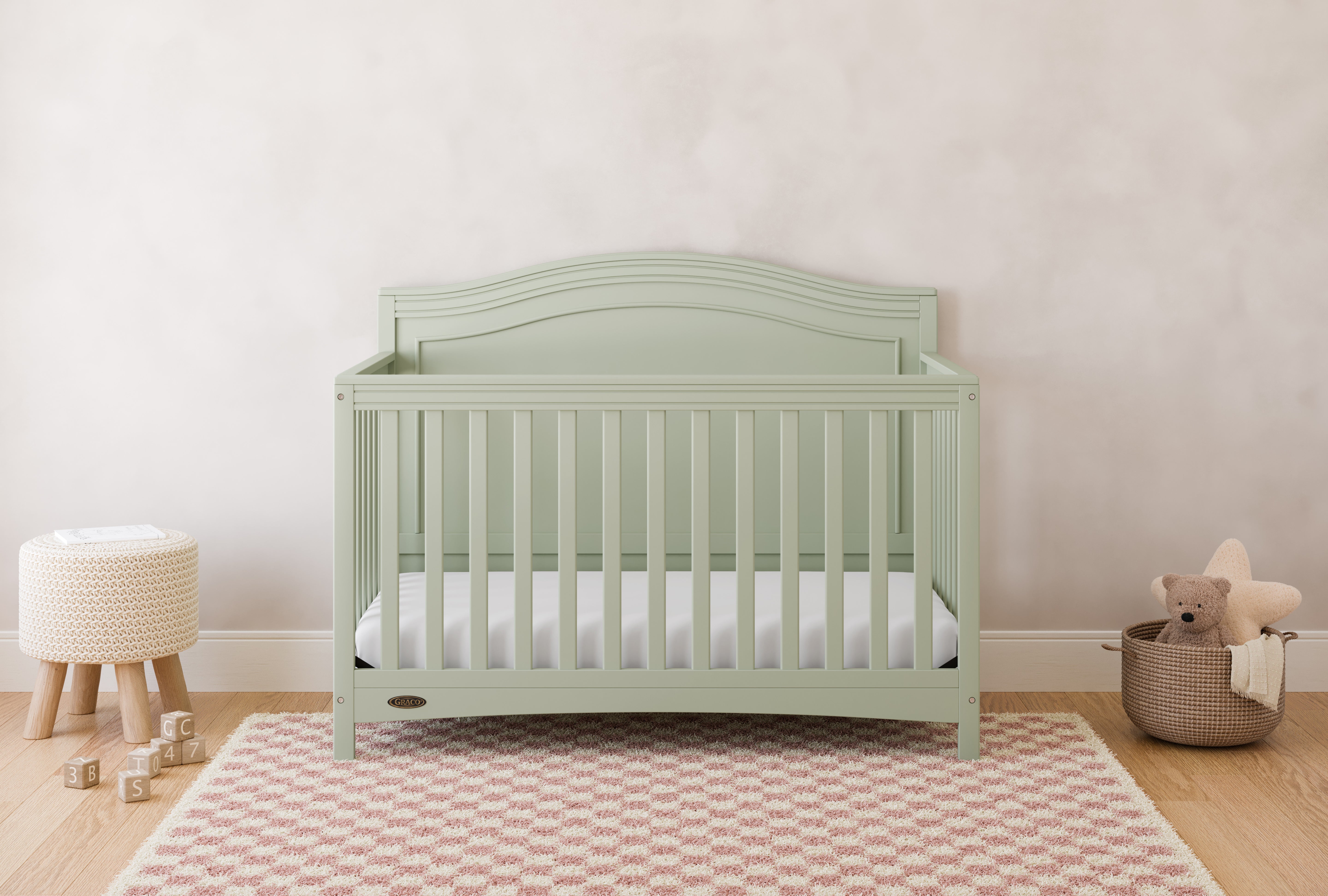 Paris sage crib in a nursery